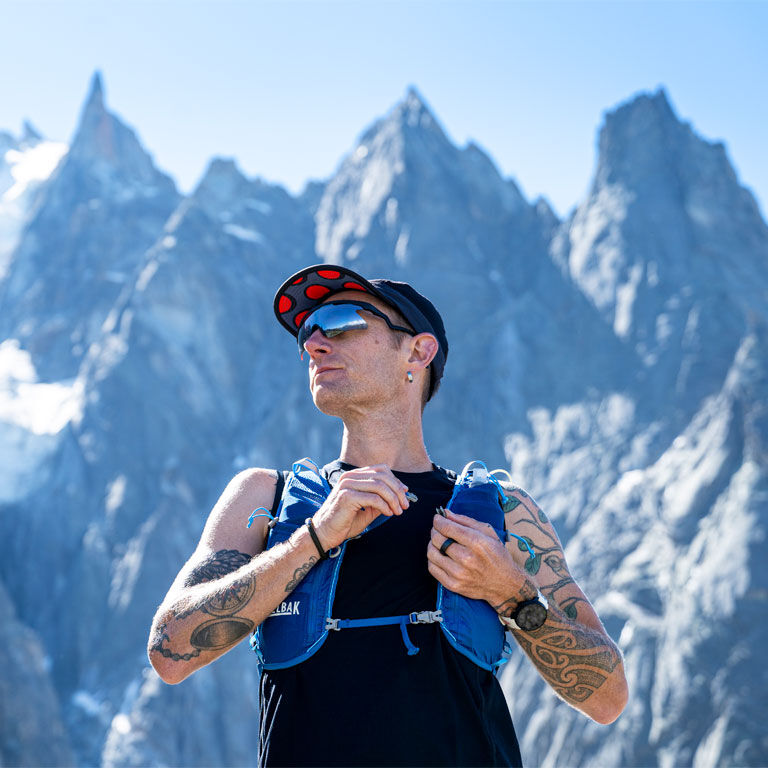 Man wearing a Zephyr Running Vest on the mountains Man wearing a Zephyr Running Vest on the mountains