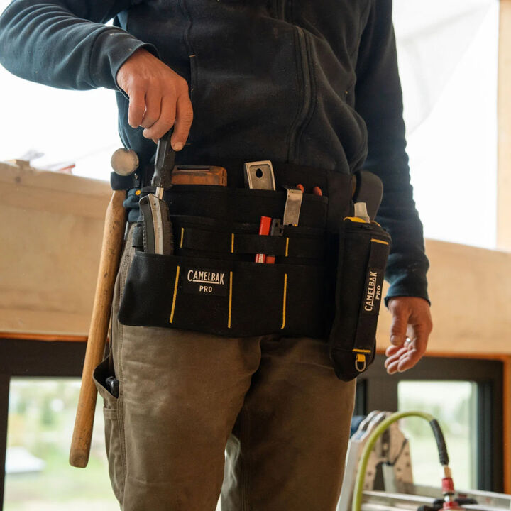 Man working construction with camelbak pro work belt
