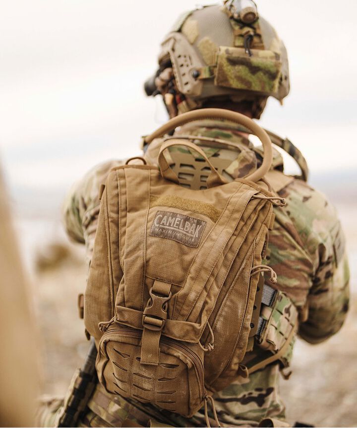 Back of person in Military with pack on