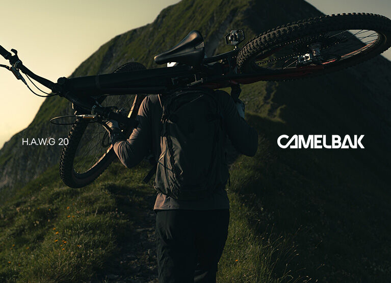 cyclist on a trail wearing a hawg backpack