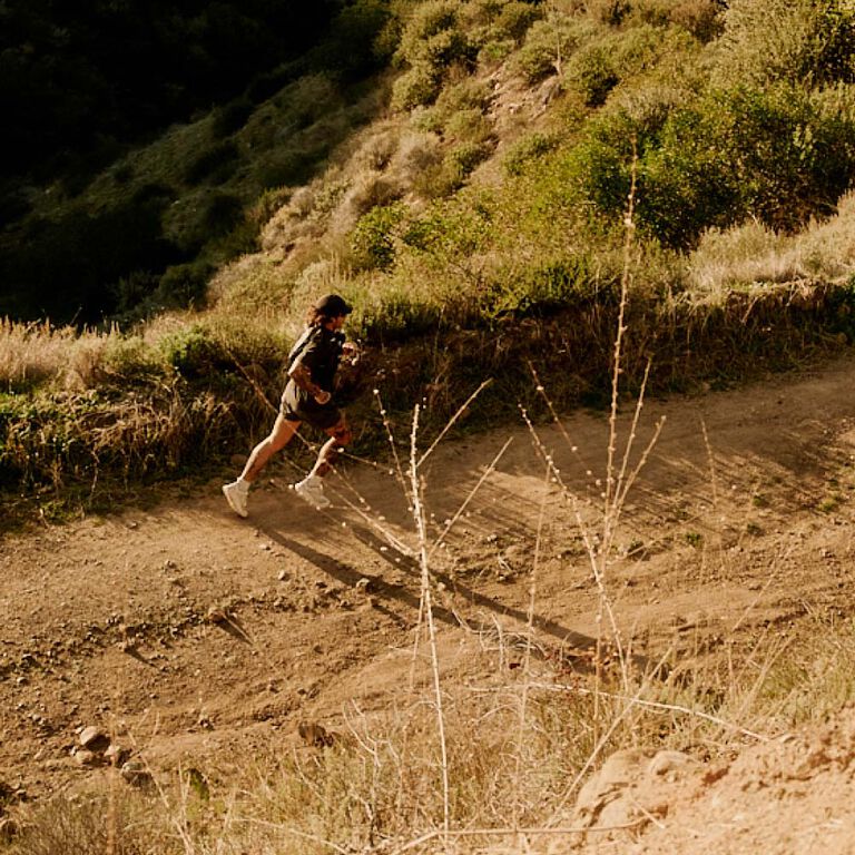 A man running with a camelbak pack