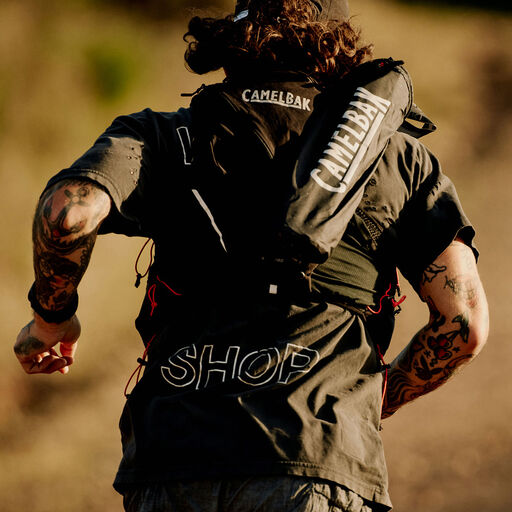 A man running with a camelbak pack
