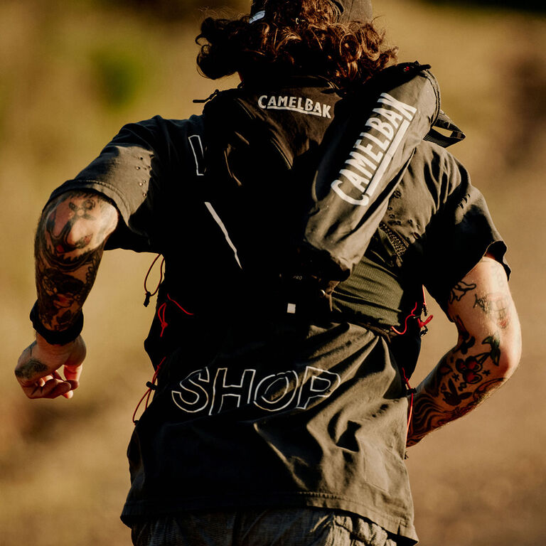 A man running with a camelbak pack