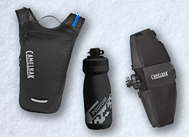 Mountain biking hydration pack, water bottle, and waist pack laid out on a white background. Mountain biking hydration pack, water bottle, and waist pack laid out on a white background.