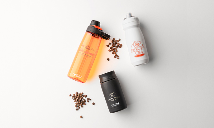 Three custom water bottles with coffee beans. Three custom water bottles with coffee beans.