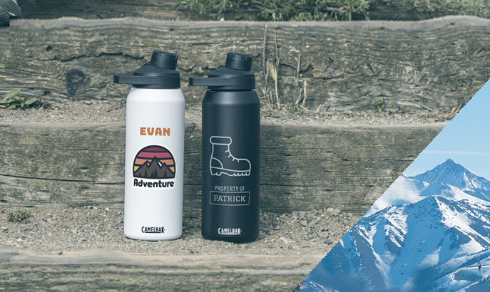 Two insulated stainless steel custom water bottles on wood steps Two insulated stainless steel custom water bottles on wood steps