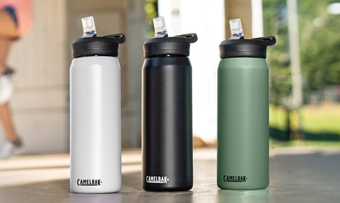 Three Eddy+ stainless steel bottles in different colors.
