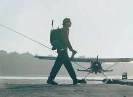 Guy walking on a runway