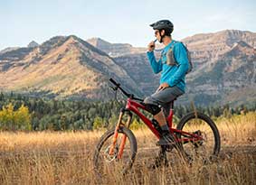 Man on mountain bike in a field. Man on mountain bike in a field.