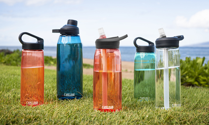 Five Tritan Renew bottles on the grass. Five Tritan Renew bottles on the grass.