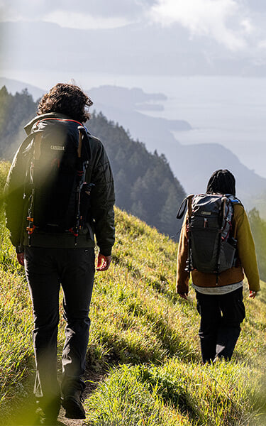 Two hikers on a trail in the Bay Area