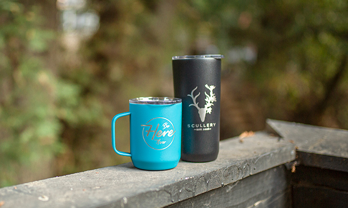 Two Drinkware vessels with custom etching designs.