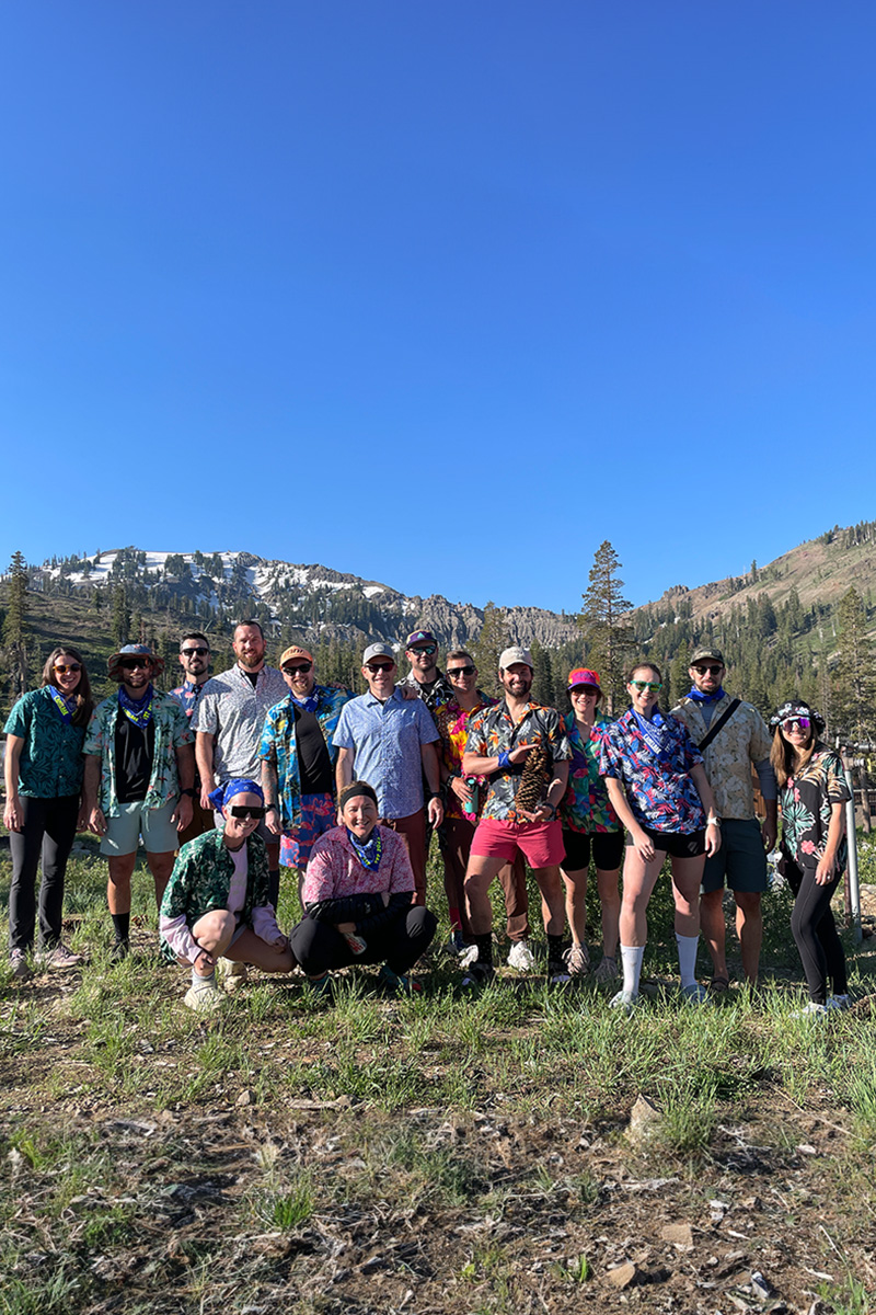 A group of CamelBak employees, posing for a photo in their Aloha Friday outfits right before the start of the Ragnar Trail Race