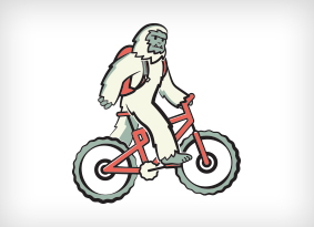 Yeti riding a bike with a hydration pack on. Yeti riding a bike with a hydration pack on.
