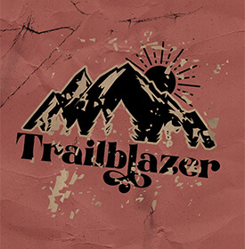 A distressed image with mountains and a sun with "Trailblazer" beneath it. 